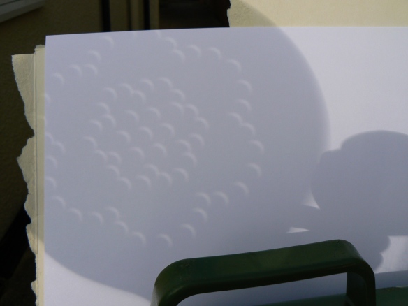 We strained the solar eclipse through a colander for safe viewing of this cosmic event....